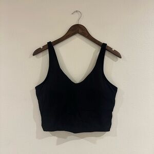 Black cropped sports tanks with built in bra and removable padding.